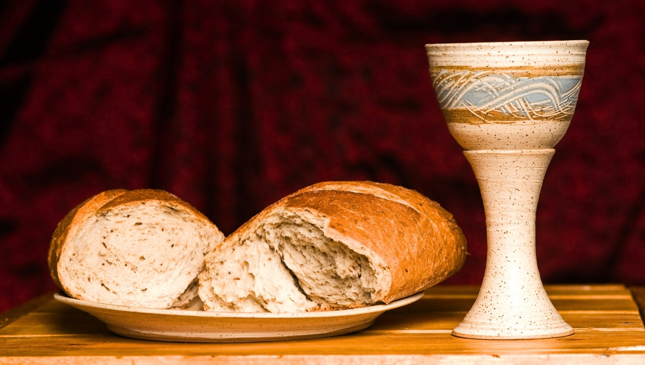 communion bread and chalice on altar